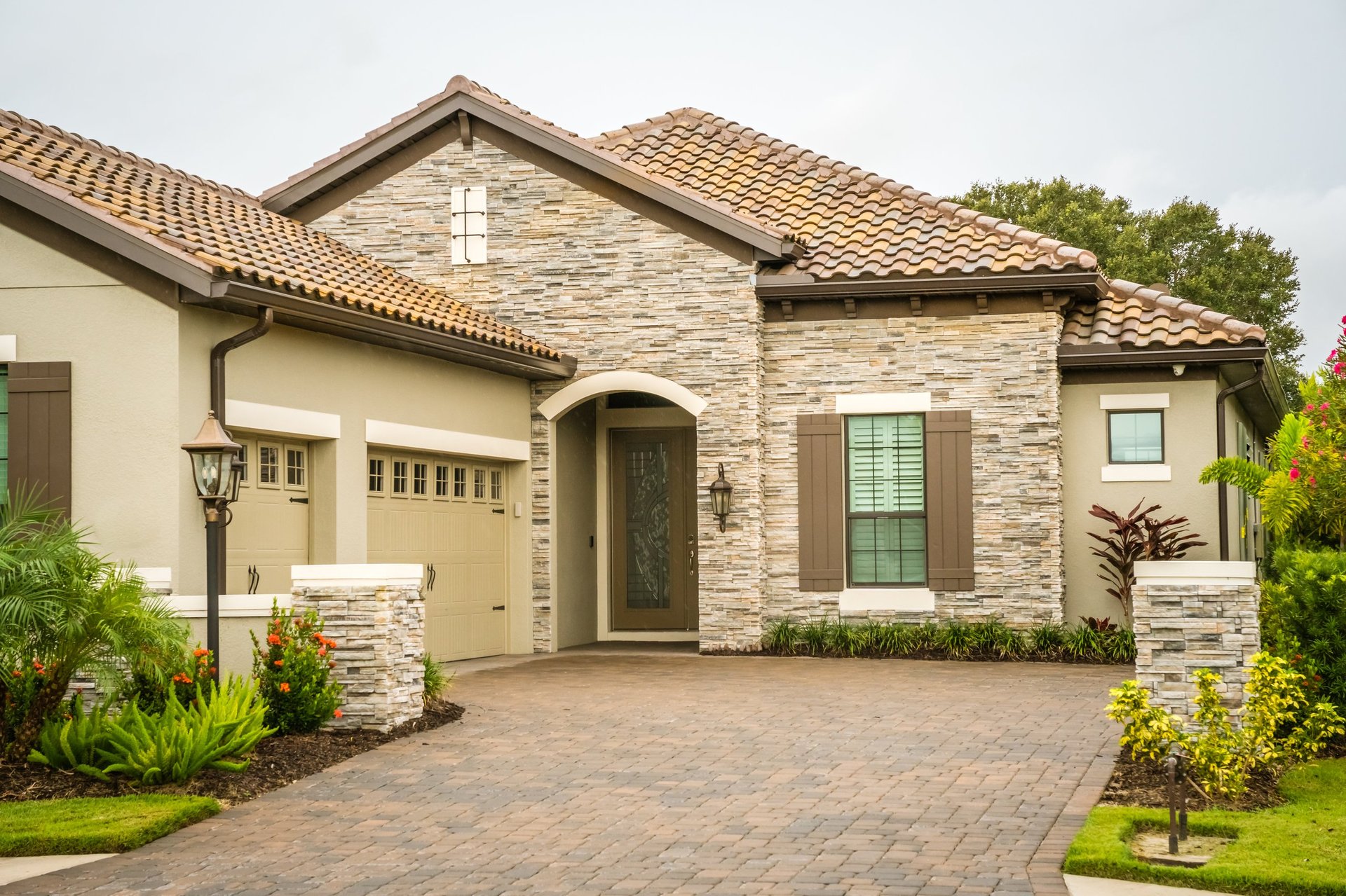 Modern Florida home with sealed paver driveway showing rich colour enhancement in Ocala Marion County