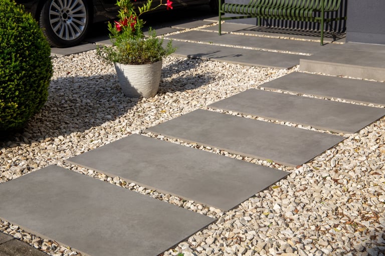 Modern front garden with ornamental chippings and paving slabs