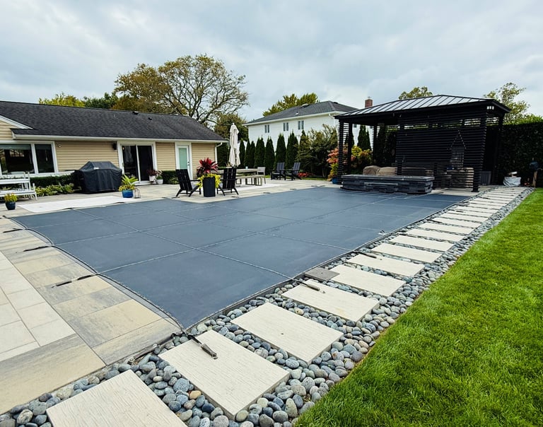 Melting snow rain drains through paver pool cover for wintertime